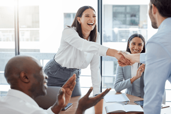 Manager leading a strategy meeting with employees in a corporate office.
