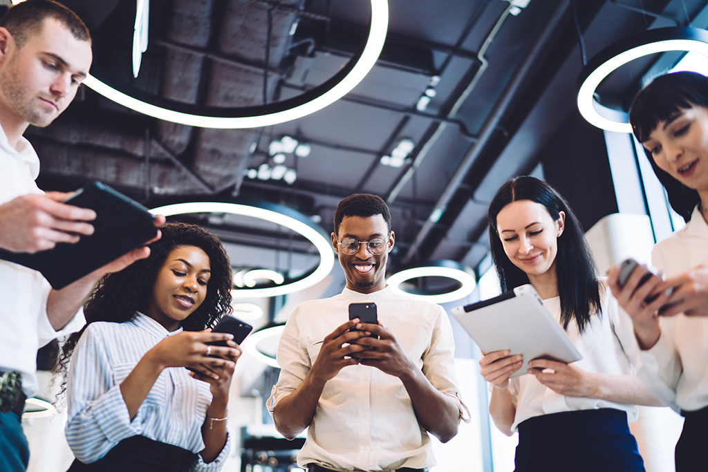 group of people looking at their bot chat on the phone