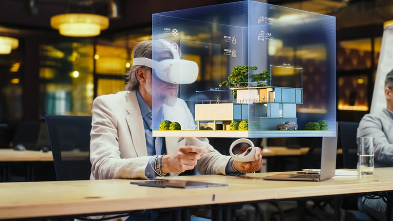 A man working on a prototype of a house using spatial computing meta quest