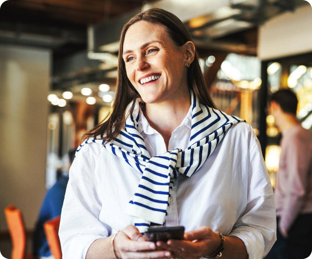happy employee with mobile being recognized