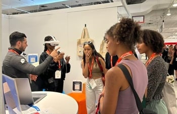 Attendees exploring 3D design presentations with Meta's VR at NeoCon in Chicago