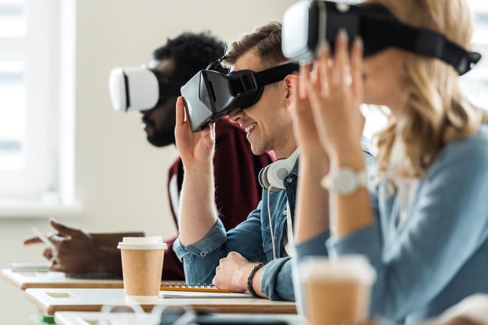 Business professionals using VR headsets in a modern office environment, symbolizing the integration of Metaverse technologies into business strategies.