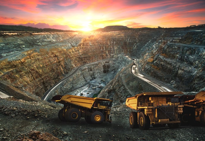 A geologist using a VR headset to interact with a 3D model of a mine,