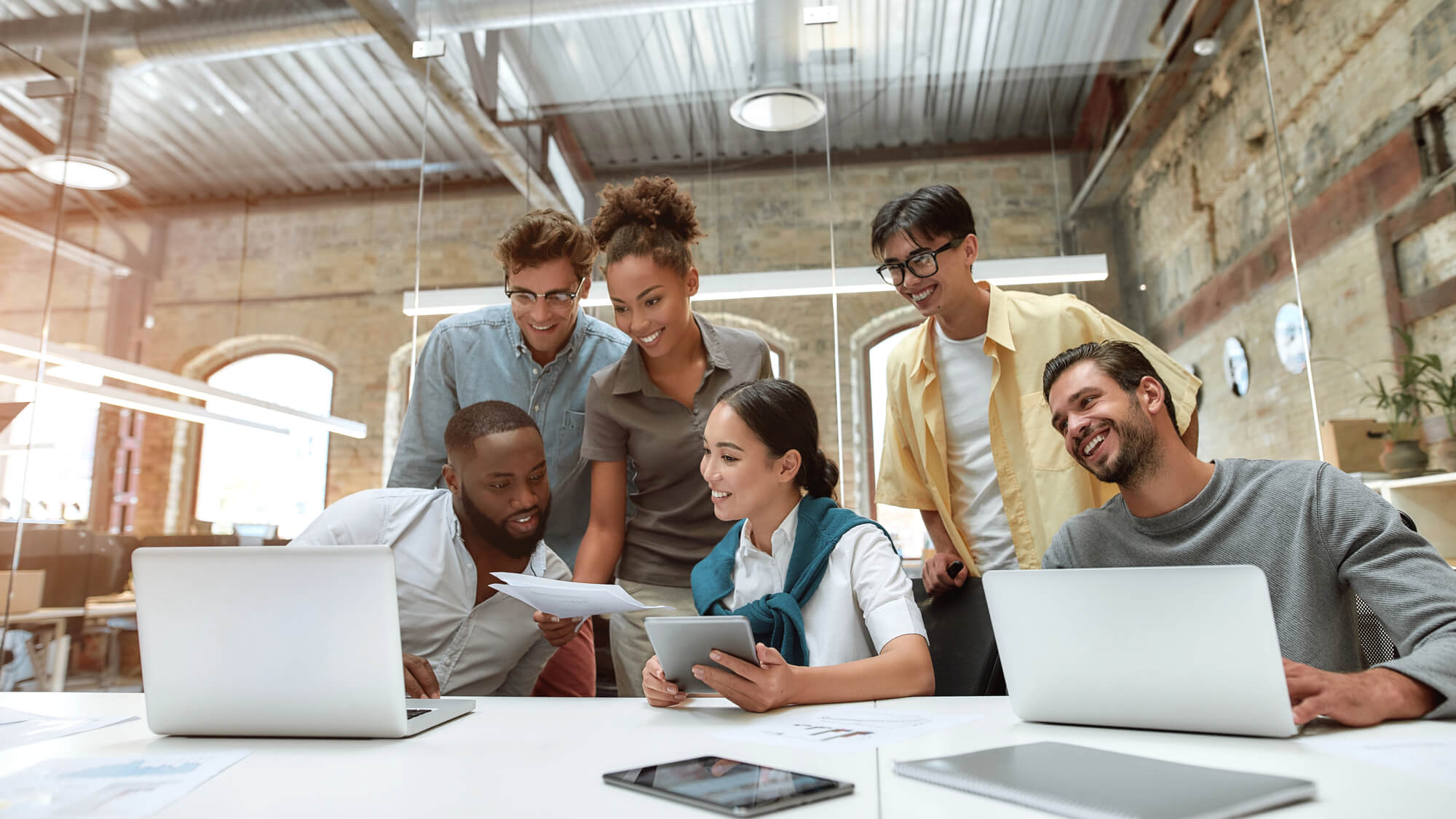 Team of enthusiastic co-workers brainstorming and collaborating together
